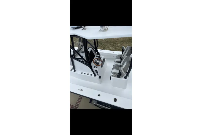 Slide: The Image of 2021 ZCB 26 Freemason boat interior with steering console and seating arrangement. - 9