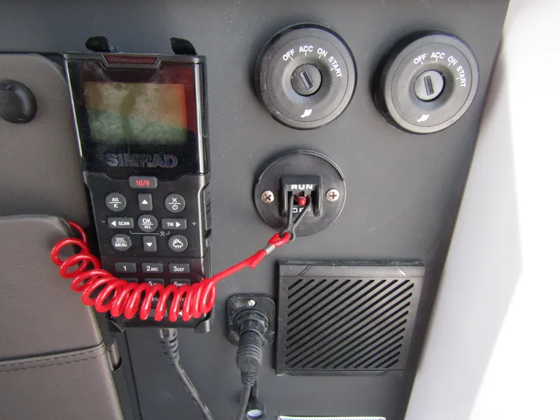 Slide: The Image of Control panel of 2024 Axopar 37XC CROSS CABIN with Simrad radio and ignition switch. - 17