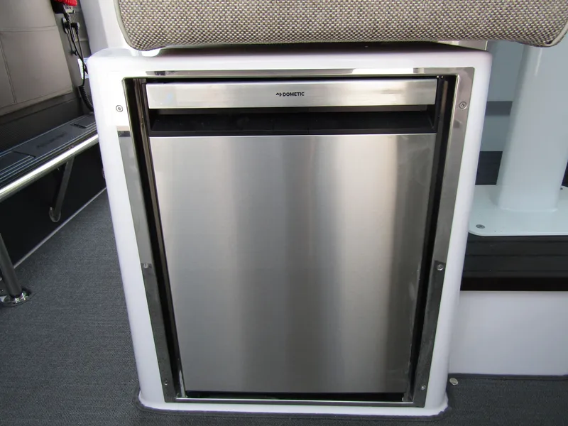 Slide: The Image of Built-in stainless steel refrigerator in the 2024 Axopar 37XC Cross Cabin boat. - 19