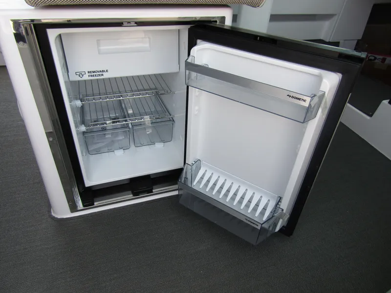 Slide: The Image of Open refrigerator in the 2024 Axopar 37XC CROSS CABIN boat. - 20