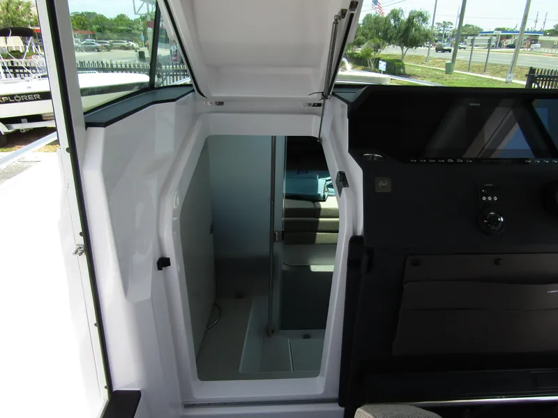 Slide: The Image of Interior view of 2024 Axopar 37XC CROSS CABIN, showing cabin entrance and dashboard. - 21