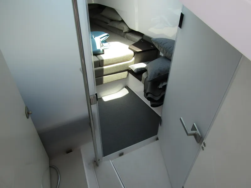 Slide: The Image of 2024 Axopar 37XC CROSS CABIN interior view with cozy seating area. - 22