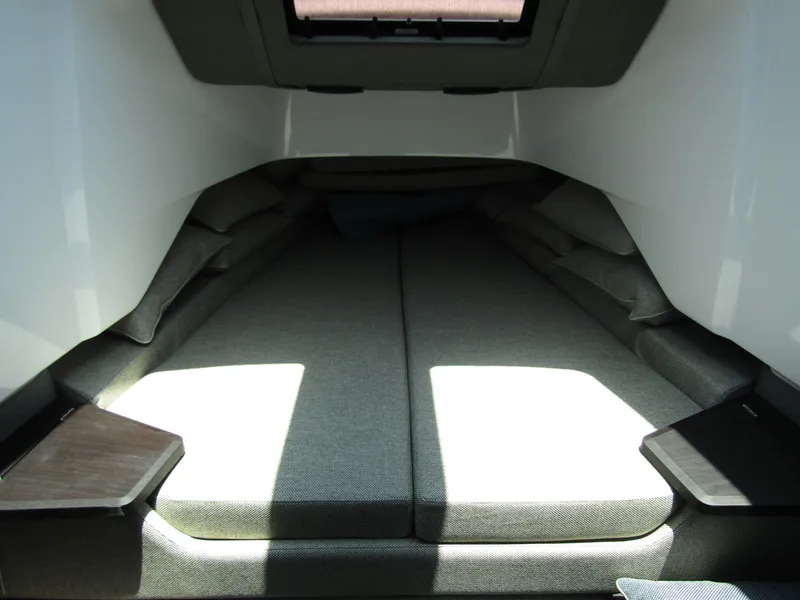 Slide: The Image of 2024 Axopar 37XC CROSS CABIN interior cabin with cushioned bed and skylight. - 27