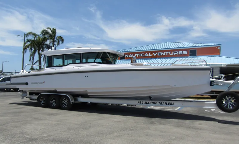 Slide: The Image of 2024 Axopar 37XC CROSS CABIN boat on a trailer at Nautical Ventures. - 3
