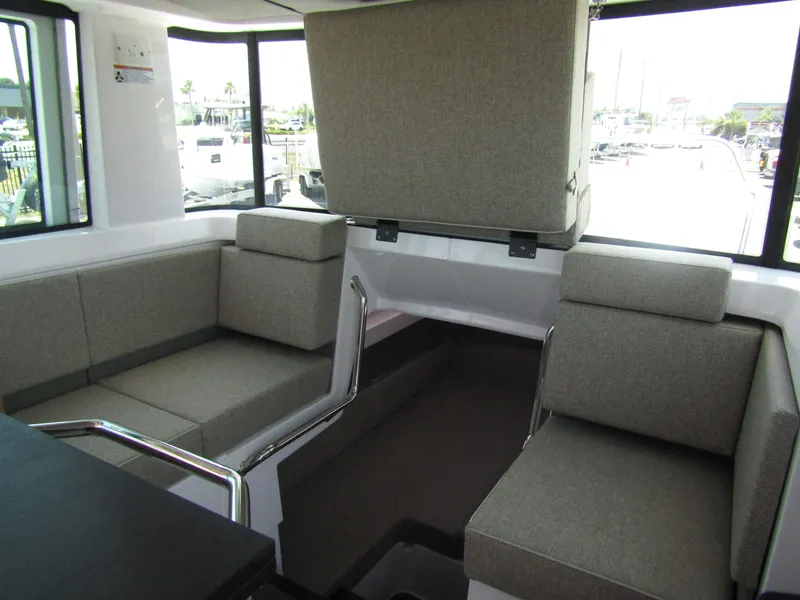 Slide: The Image of Interior seating area of 2024 Axopar 37XC CROSS CABIN boat with grey cushions. - 31