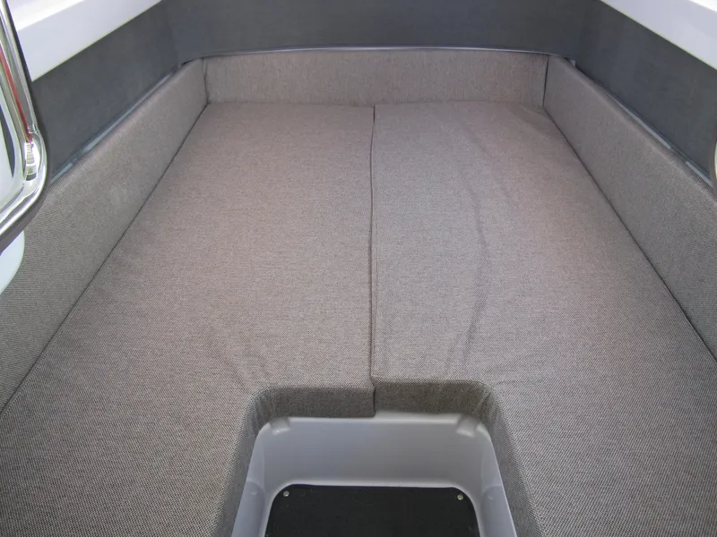 Slide: The Image of Interior seating area of 2024 Axopar 37XC CROSS CABIN boat with grey upholstery. - 32