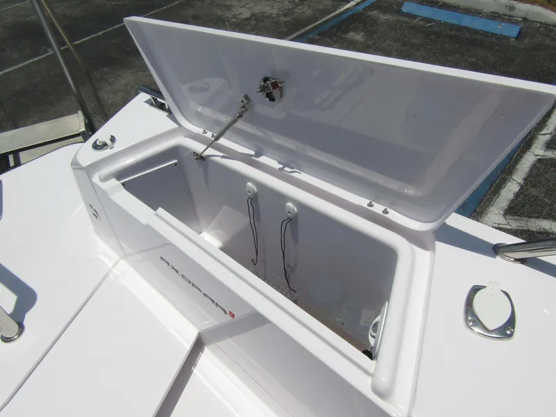 Slide: The Image of Open storage compartment on the 2024 Axopar 37XC CROSS CABIN boat. - 35