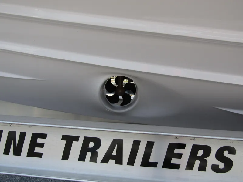 Slide: The Image of Close-up of 2024 Axopar 37XC CROSS CABIN boat hull and trailer. - 5