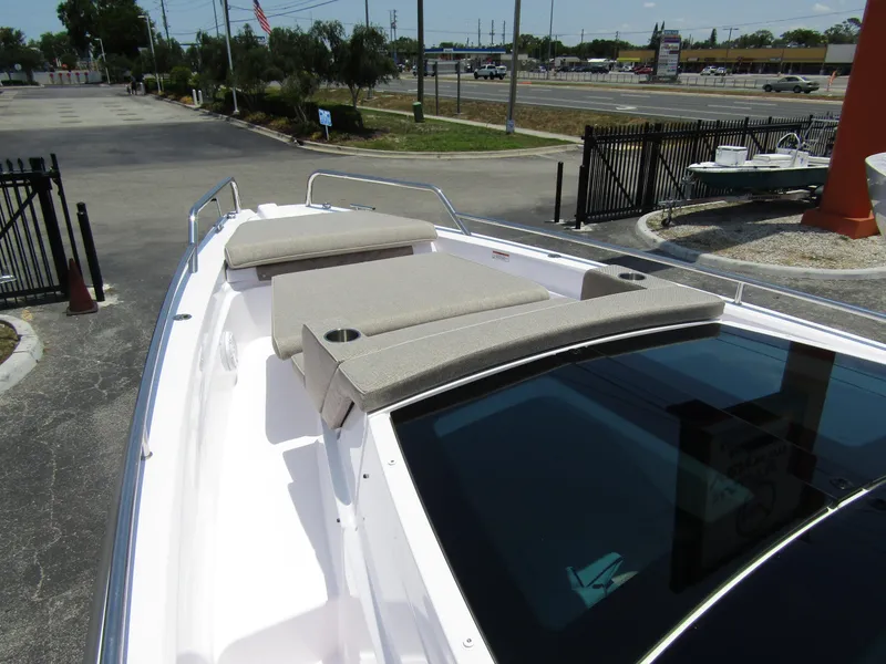 Slide: The Image of 2024 Axopar 37XC CROSS CABIN boat with sun loungers on deck. - 9