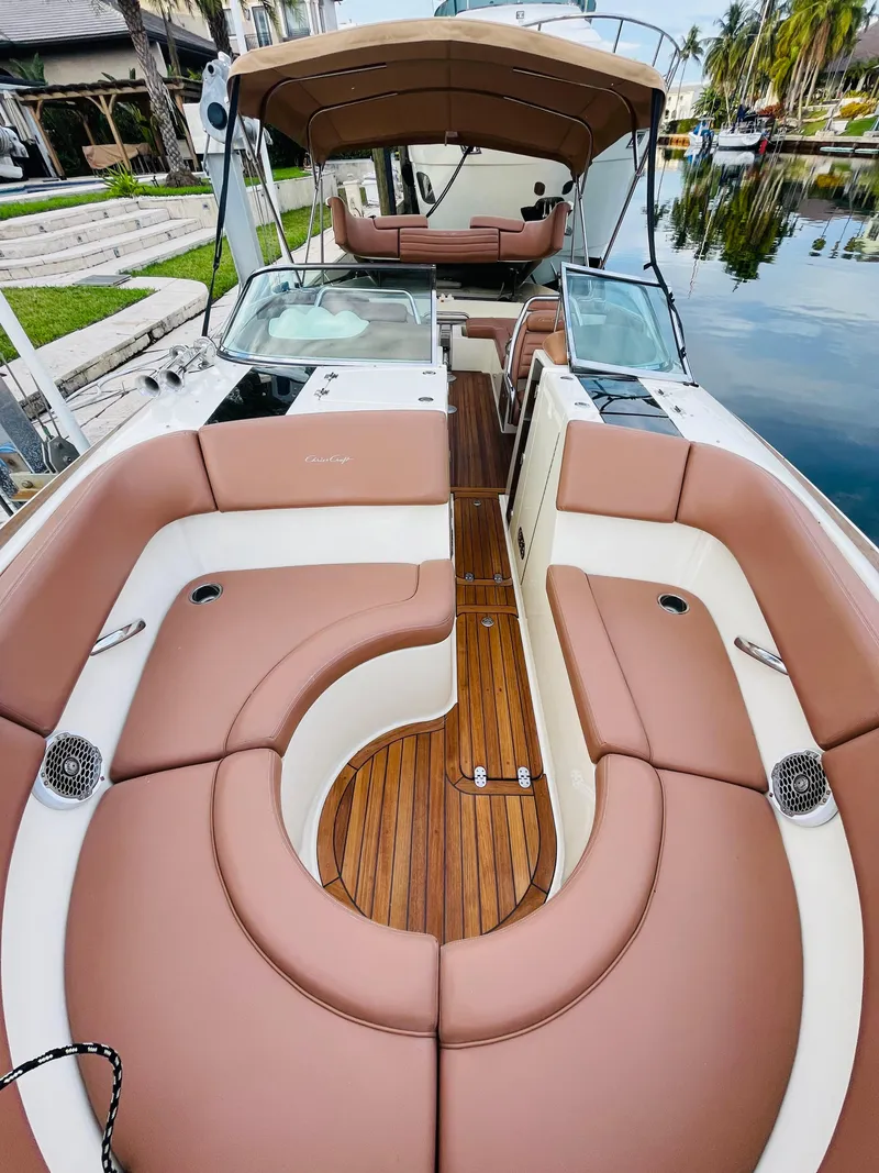 Slide: The Image of 2014 Chris-Craft Launch 32 boat with luxurious seating and wooden deck. - 11