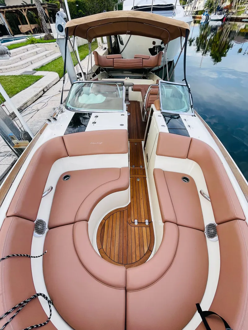 Slide: The Image of 2014 Chris-Craft Launch 32 boat with luxurious seating and teak flooring. - 13