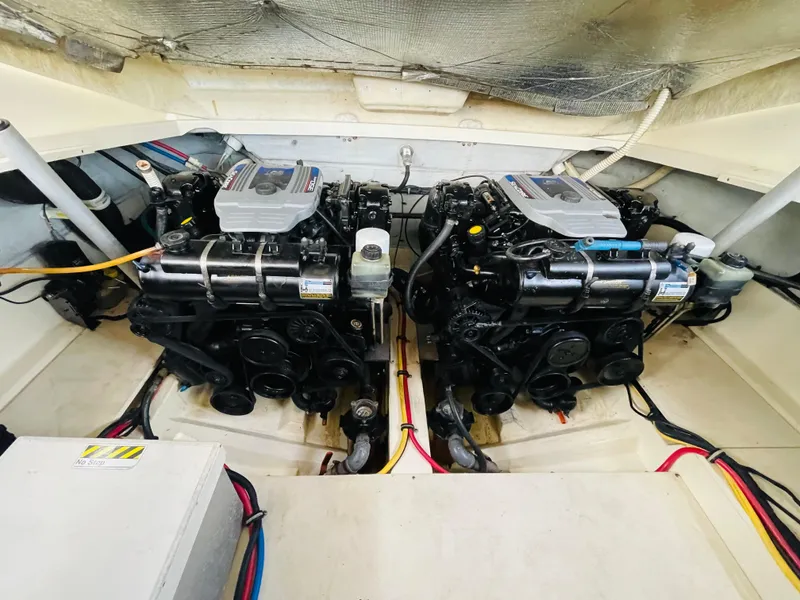 Slide: The Image of 2014 Chris-Craft Launch 32 engine compartment with dual engines. - 18