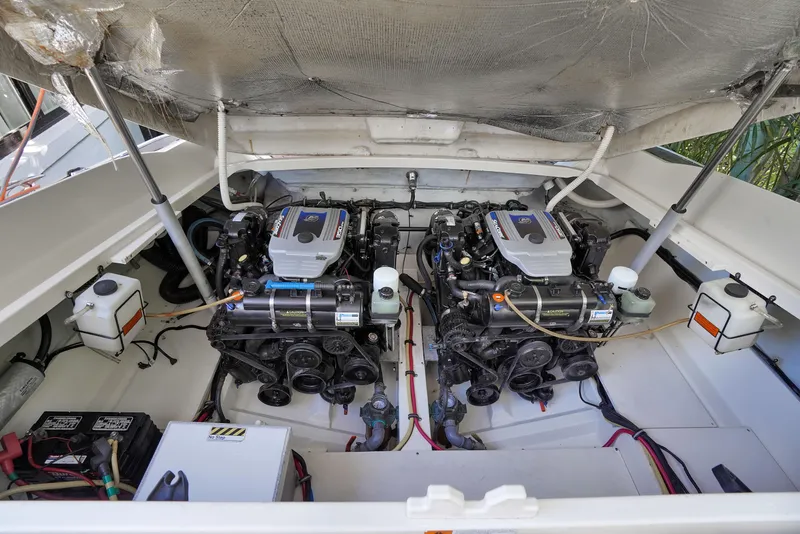 Slide: The Image of 2014 Chris-Craft Launch 32 engine compartment with twin engines and clean layout. - 19