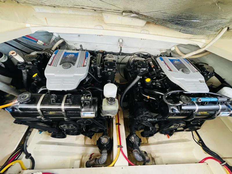 Slide: The Image of 2014 Chris-Craft Launch 32 engine compartment with twin MerCruiser engines. - 20
