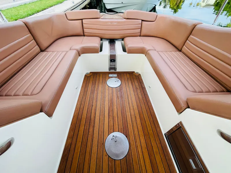 Slide: The Image of 2014 Chris-Craft Launch 32 boat with luxurious brown leather seating and teak flooring. - 3