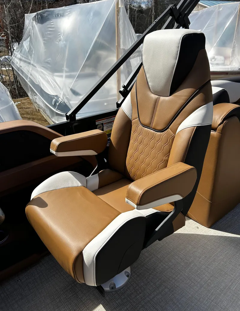 Slide: The Image of 2024 Avalon LSZ Entertainer 23' boat captain's chair, brown and beige upholstery. - 15