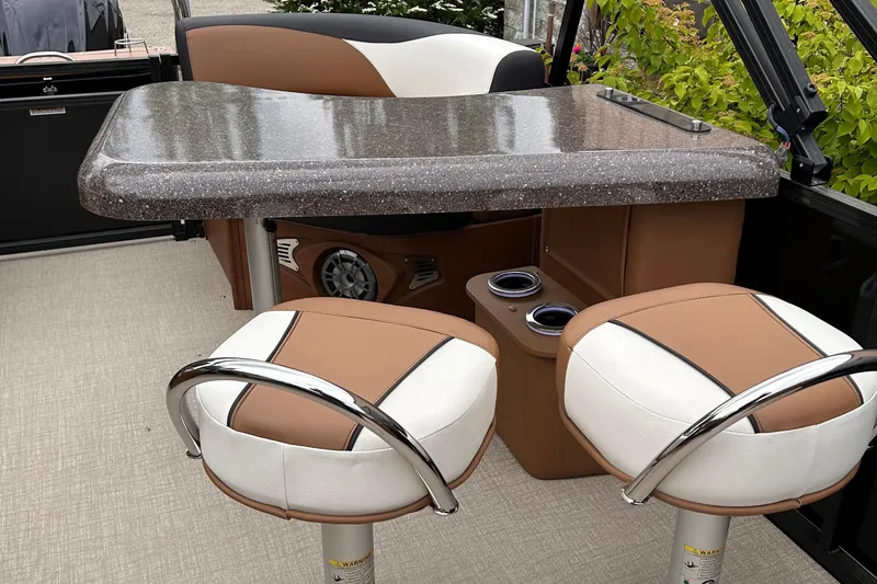 Slide: The Image of 2024 Avalon LSZ Entertainer 23' boat interior with table and seating. - 16