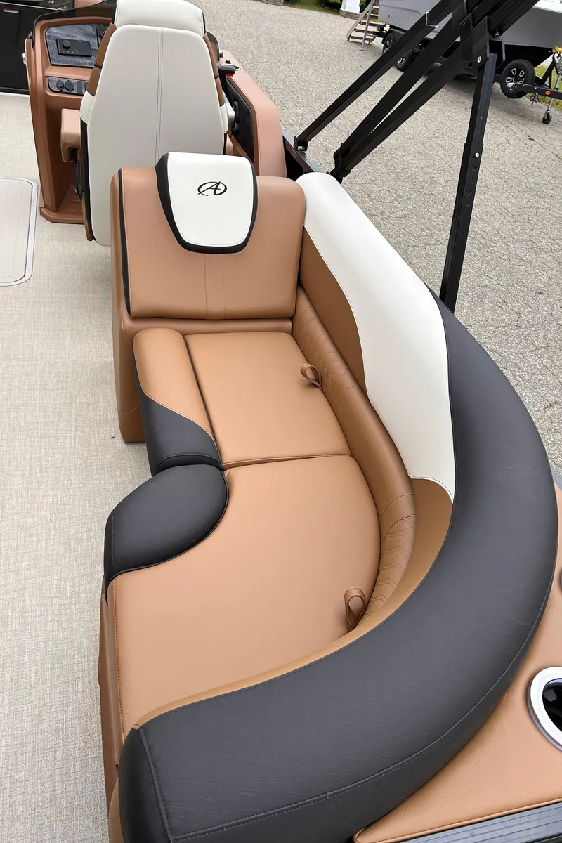 Slide: The Image of 2024 Avalon LSZ Entertainer 23' boat interior with luxurious seating. - 21