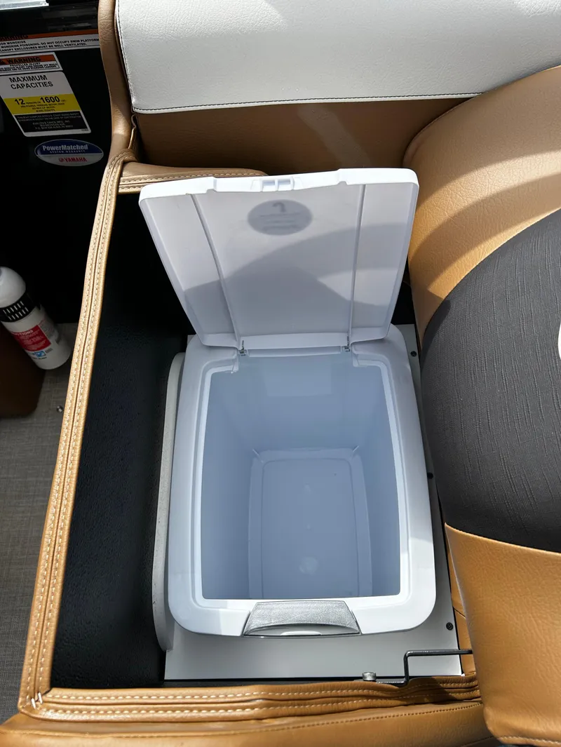 Slide: The Image of 2024 Avalon LSZ Entertainer 23' boat with built-in cooler compartment. - 26