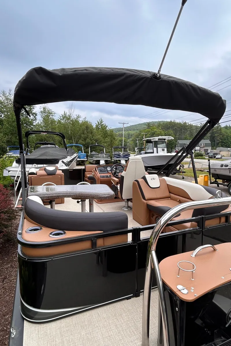 Slide: The Image of 2024 Avalon LSZ Entertainer 23' pontoon boat with black and tan interior. - 29
