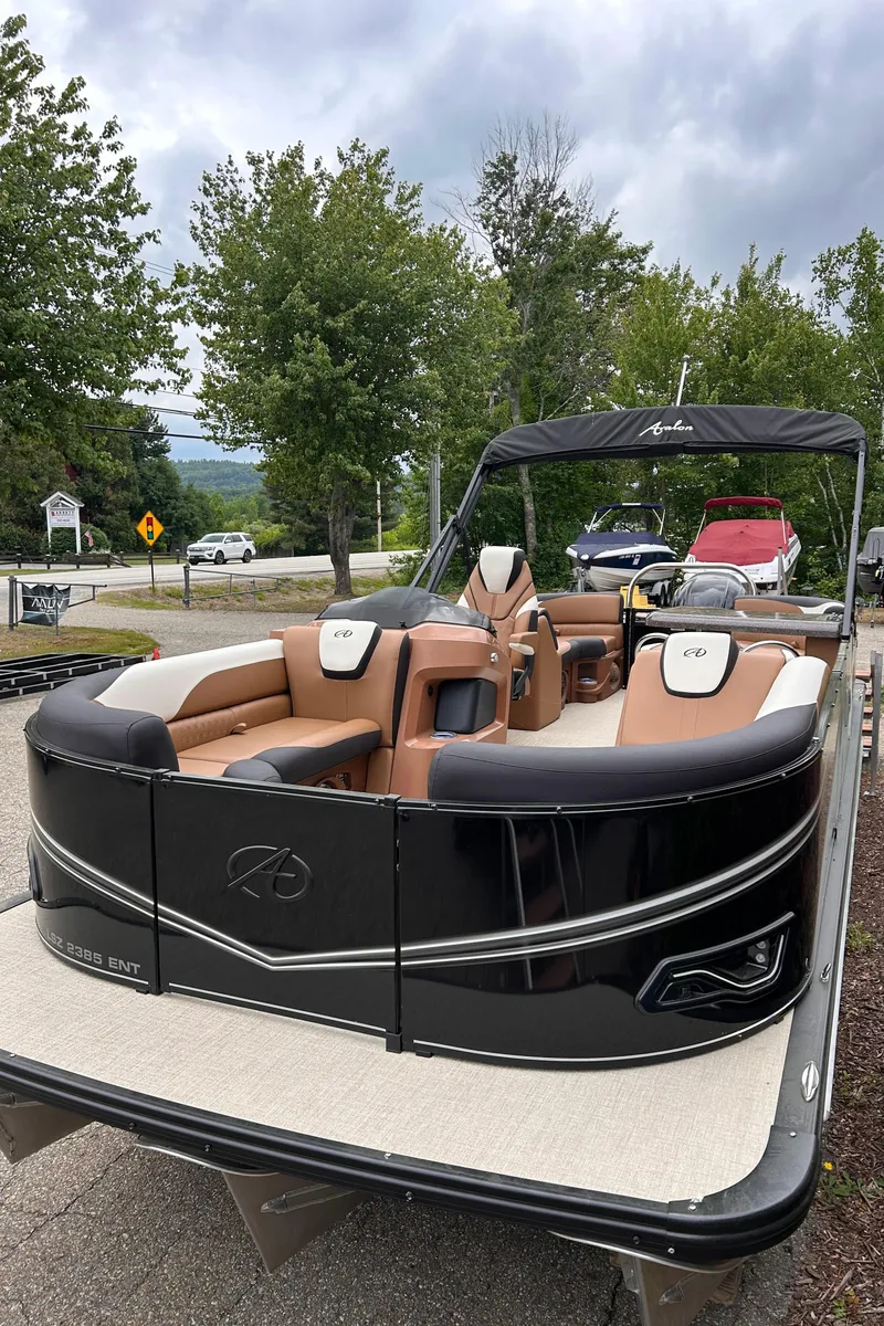 Slide: The Image of 2024 Avalon LSZ Entertainer 23' pontoon boat with luxurious seating and sleek design. - 3