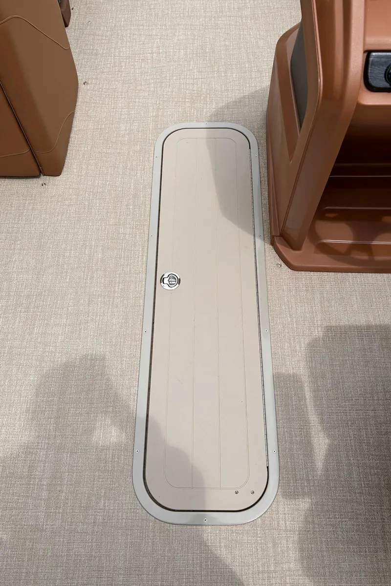 Slide: The Image of 2024 Avalon LSZ Entertainer 23' boat deck with storage compartment. - 33