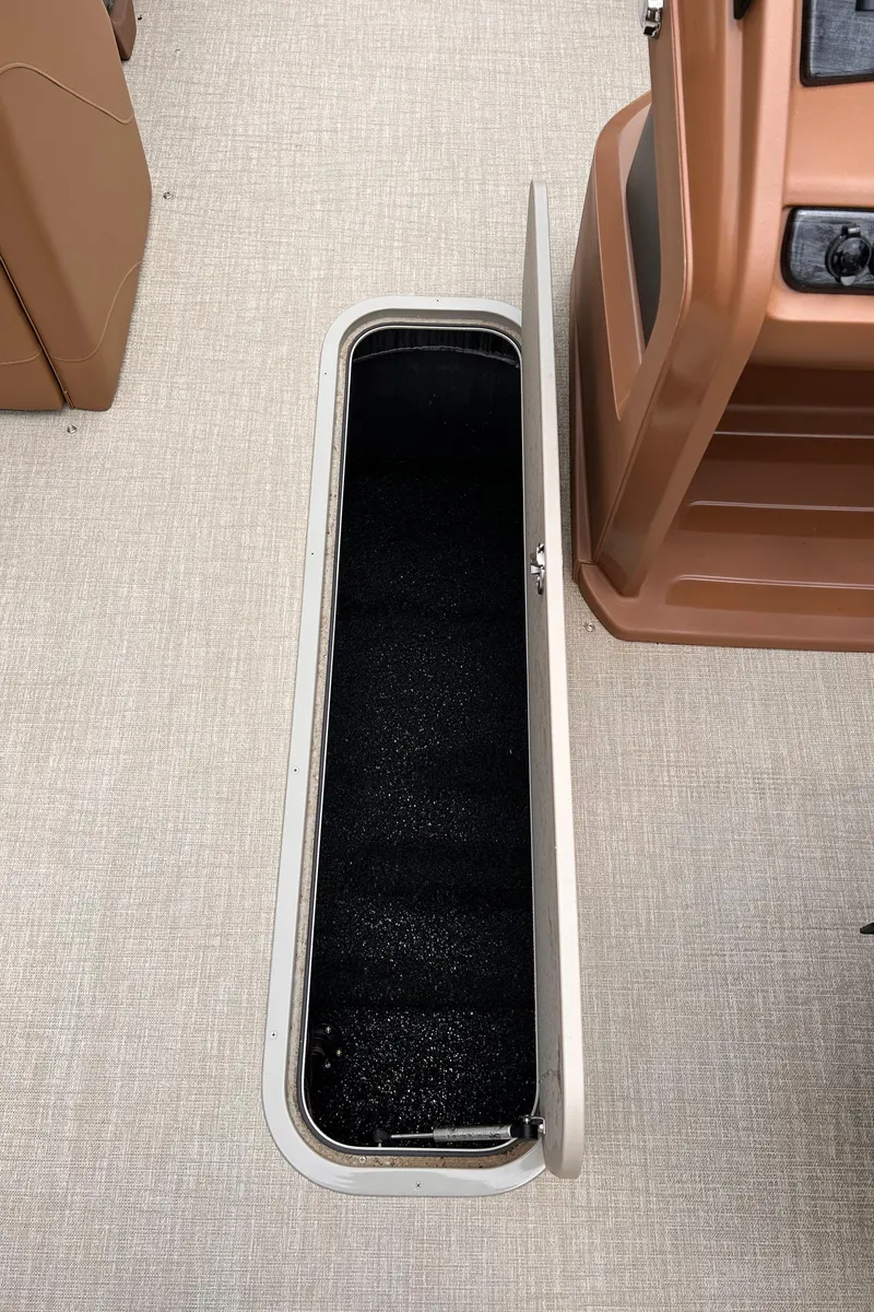 Slide: The Image of 2024 Avalon LSZ Entertainer 23' boat storage compartment. - 34