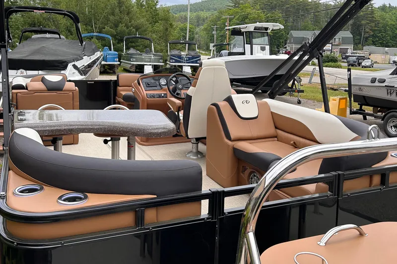 Slide: The Image of 2024 Avalon LSZ Entertainer 23' pontoon boat with luxurious seating and modern amenities. - 5