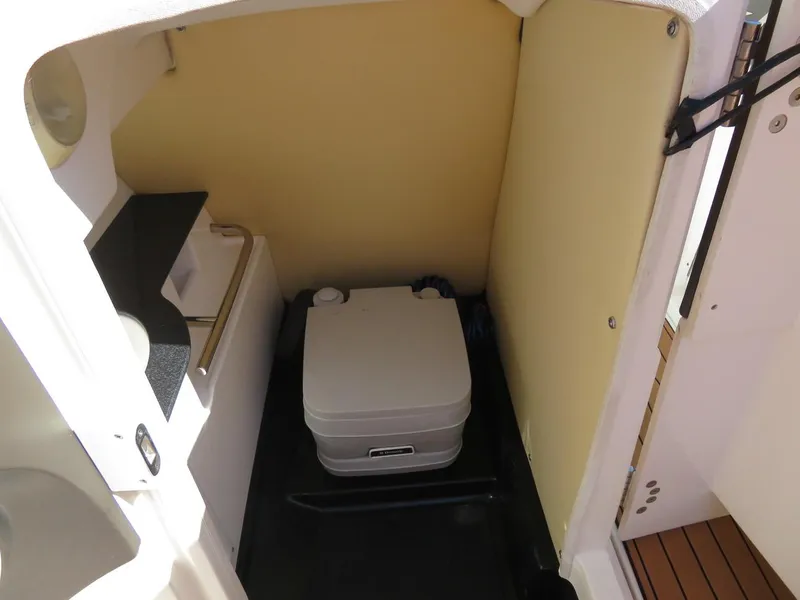 Slide: The Image of 2009 MasterCraft MariStar 255 boat interior with portable toilet. - 10