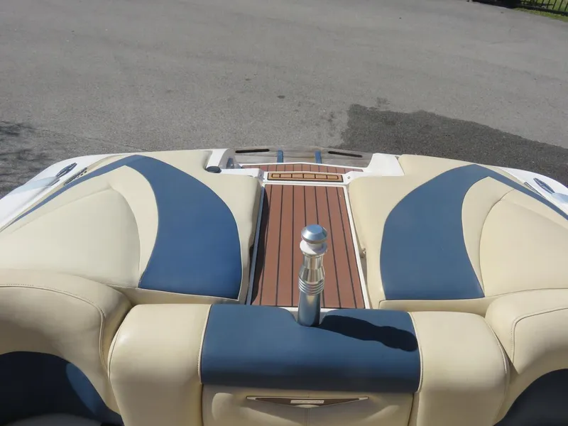 Slide: The Image of 2009 MasterCraft MariStar 255 boat interior with beige and blue seating. - 16