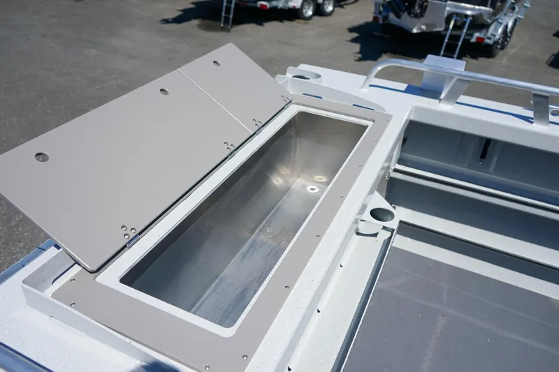 Slide: The Image of Open storage compartment on 2025 Weldcraft 240 Ocean King boat. - 16
