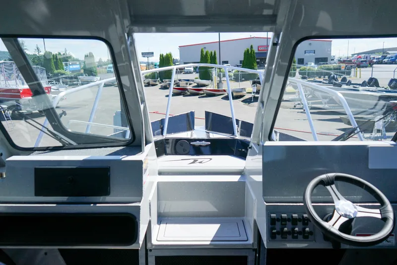 Slide: The Image of Interior view of 2025 Weldcraft 240 Ocean King boat cockpit. - 2