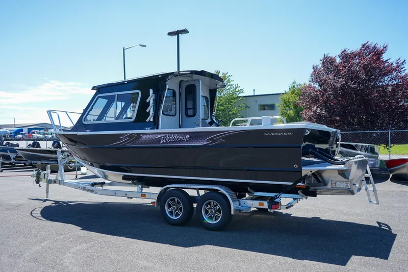 Slide: The Image of 2025 Weldcraft 240 Ocean King boat on a trailer in a parking lot. - 3