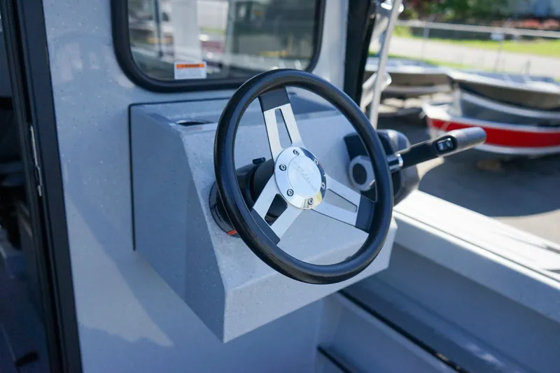 Slide: The Image of 2025 Weldcraft 240 Ocean King steering wheel and control panel. - 8