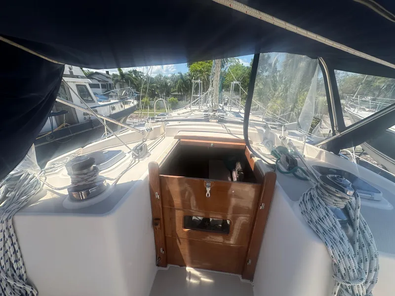 Slide: The Image of Island Packet 420 sailboat cockpit view, 2002 model, docked at marina. - 11