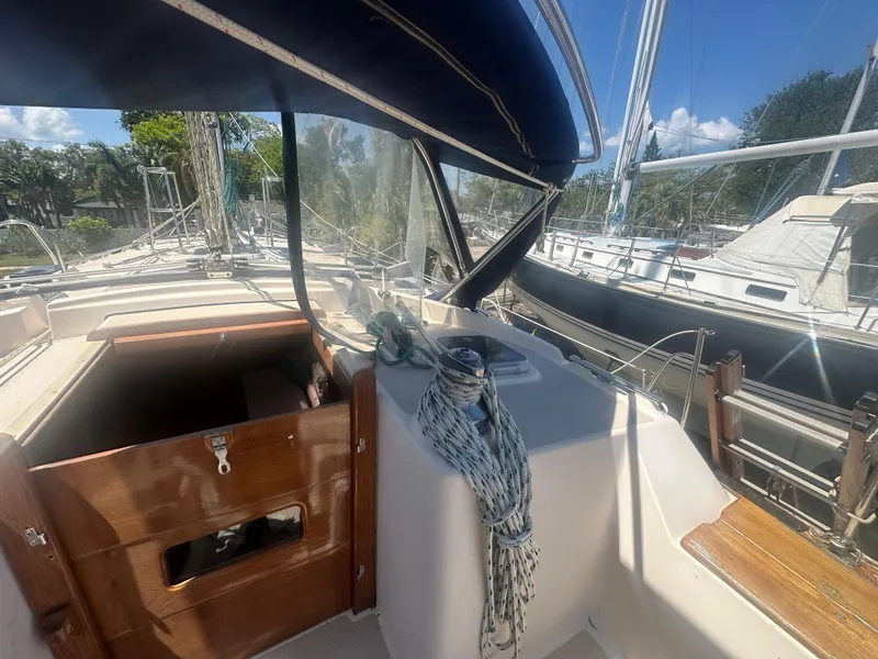 Slide: The Image of Island Packet 420 sailboat cockpit, 2002 model, with wooden hatch and ropes. - 12