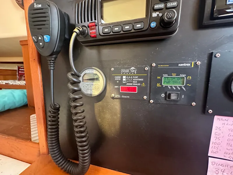 Slide: The Image of Island Packet 420 2002 model control panel with radio and monitoring equipment. - 19