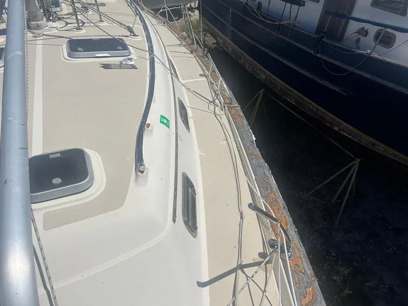 Slide: The Image of Top deck view of a 2002 Island Packet 420 sailboat, showing rigging and hatches. - 3