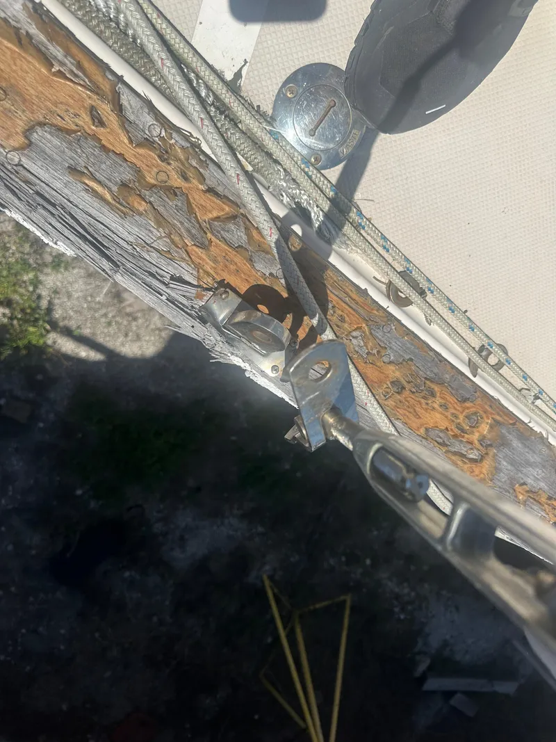 Slide: The Image of Close-up of weathered wood and metal hardware on a 2002 Island Packet 420 sailboat. - 4