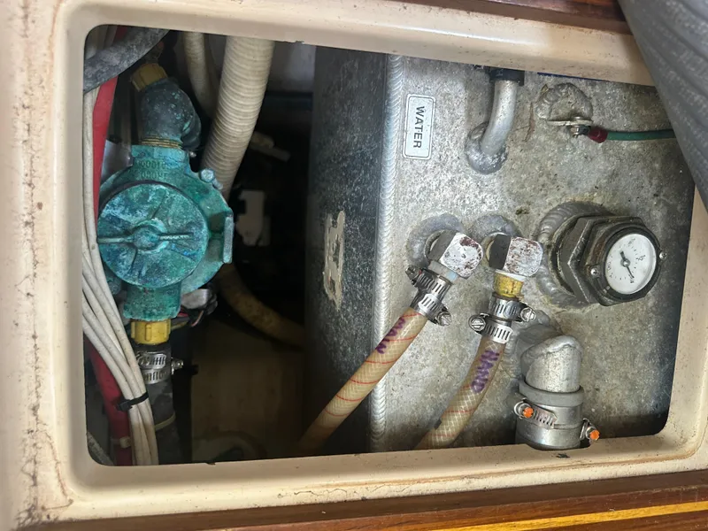 Slide: The Image of Island Packet 420 (2002) water system components and plumbing. - 48