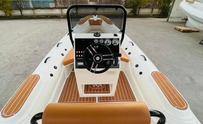 Slide: The Image of Aqvaboats Luxrib 22, 2025 model, luxury inflatable boat interior with steering console. - 24