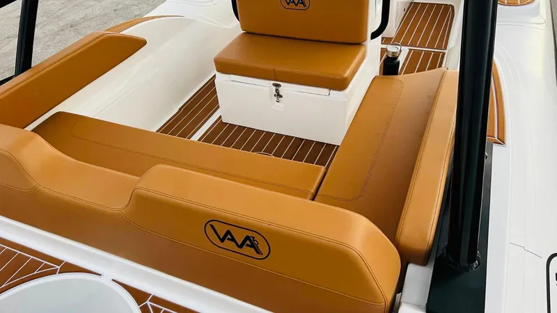 Slide: The Image of 2025 Aqvaboats Luxrib 22 interior with tan leather seats and white accents. - 25