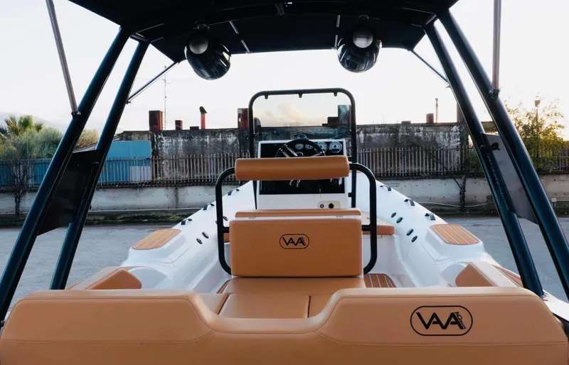 Slide: The Image of 2025 Aqvaboats Luxrib 22, luxury boat interior with tan seating and modern controls. - 31