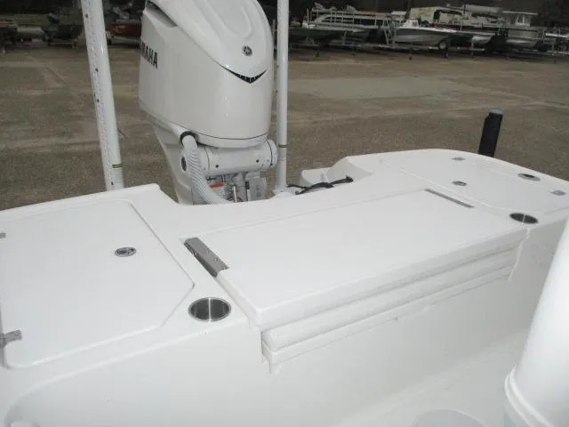 Slide: The Image of 2025 Caymas 26HB boat deck with Yamaha outboard motor, featuring storage compartments. - 5