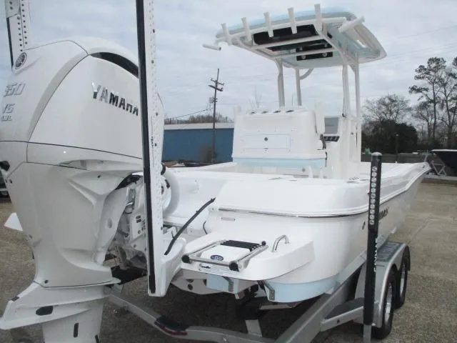 Slide: The Image of 2025 Caymas 26HB boat with Yamaha engine on trailer, featuring sleek design and modern amenities. - 7