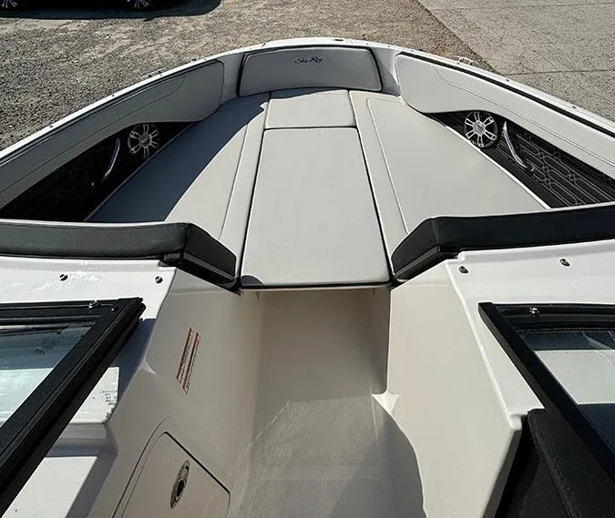 Slide: The Image of 2024 Sea Ray SPX 210 boat interior with cushioned seating and speakers. - 12