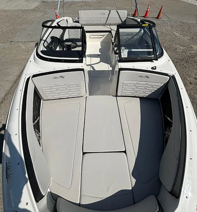 Slide: The Image of 2024 Sea Ray SPX 210 boat interior with spacious seating and modern design. - 13