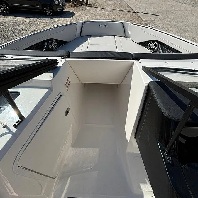 Slide: The Image of 2024 Sea Ray SPX 210 boat interior with seating and storage compartments. - 14