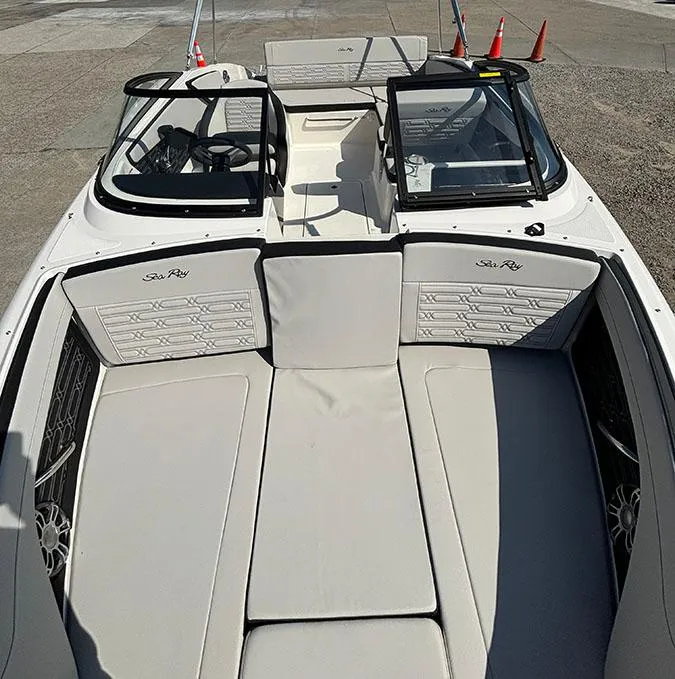 Slide: The Image of 2024 Sea Ray SPX 210 boat interior with spacious seating and modern design. - 15