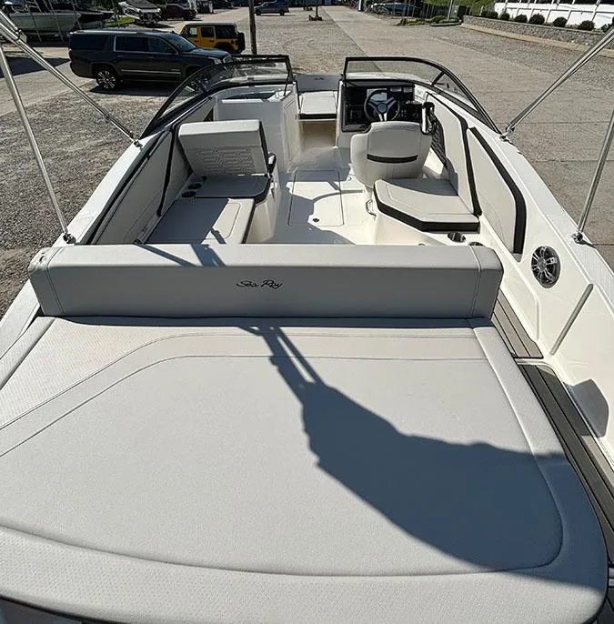 Slide: The Image of 2024 Sea Ray SPX 210 boat interior with seating and steering console. - 16